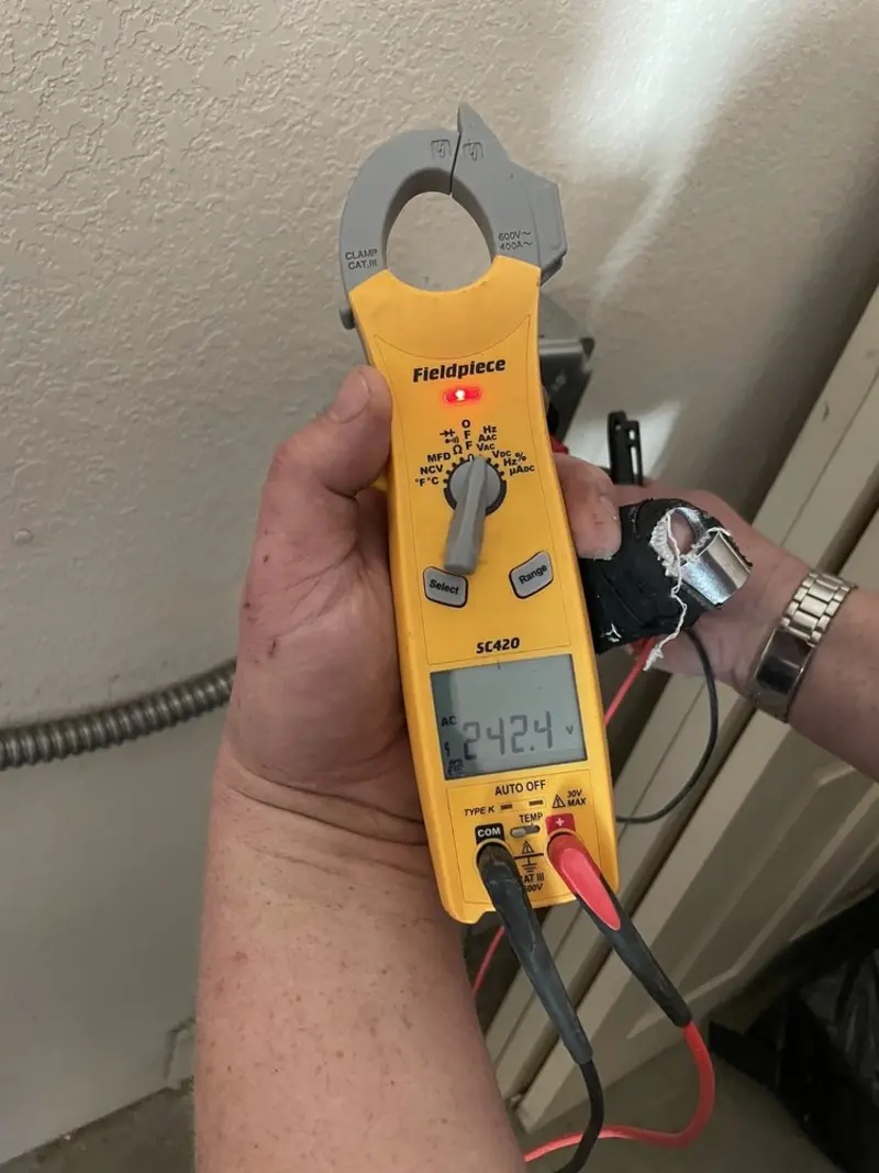 Voltage testing with clamp meter during Ceiling Fan Installation in Wellfleet